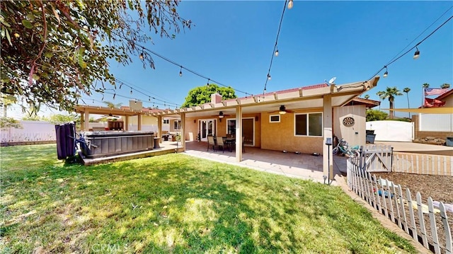 7413 Crimson Dr, Highland, CA 92346 - back of property featuring a ceiling fan, a hot tub, stucco siding, a fenced backyard, and a patio area