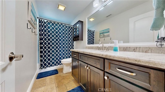 7413 Crimson Dr, Highland, CA 92346 - bathroom with vanity and stone tile flooring