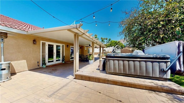 7413 Crimson Dr, Highland, CA 92346 - view of patio / terrace with french doors, a hot tub, and a ceiling fan