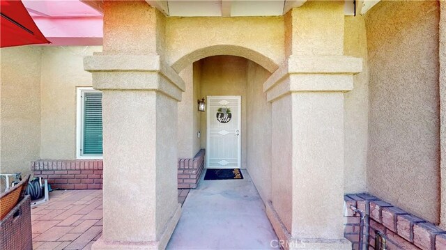 7413 Crimson Dr, Highland, CA 92346 - doorway to property with stucco siding
