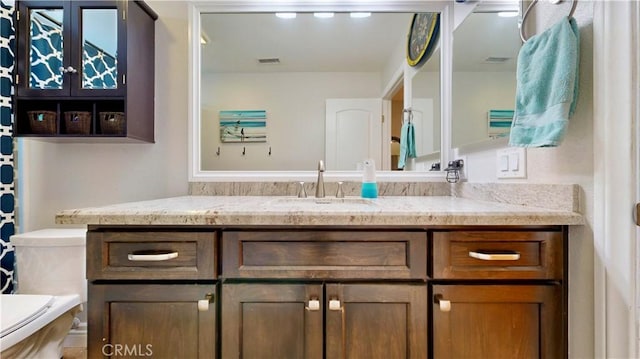 7413 Crimson Dr, Highland, CA 92346 - bathroom with toilet and vanity