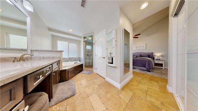 7413 Crimson Dr, Highland, CA 92346 - full bathroom featuring a shower stall, a garden tub, vanity, ensuite bathroom, and stone tile floors