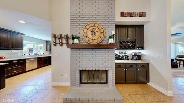 7413 Crimson Dr, Highland, CA 92346 - bar area featuring stainless steel dishwasher, a fireplace, and recessed lighting
