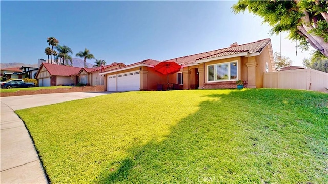 7413 Crimson Dr, Highland, CA 92346 - view of front of property featuring a tile roof, driveway, a garage, stucco siding, and a chimney