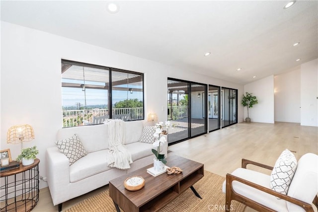 16066 Rancho Verde Cir, Riverside, CA 92506 - living room with recessed lighting and light wood finished floors