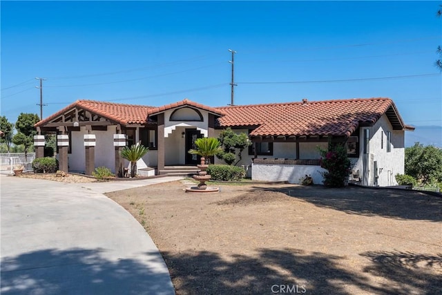 16066 Rancho Verde Cir, Riverside, CA 92506 - mediterranean / spanish-style home featuring a tile roof and stucco siding