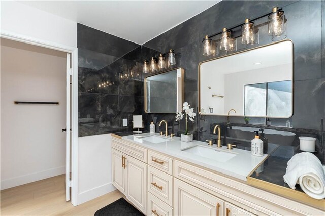 16066 Rancho Verde Cir, Riverside, CA 92506 - full bathroom with decorative backsplash, double vanity, wood finished floors, and a freestanding tub
