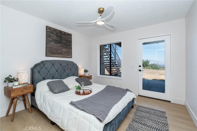 16066 Rancho Verde Cir, Riverside, CA 92506 - bedroom featuring access to outside, light wood-style floors, and a ceiling fan