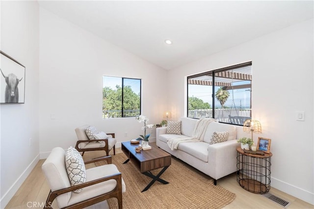 16066 Rancho Verde Cir, Riverside, CA 92506 - living room with light wood-style floors, lofted ceiling, and recessed lighting