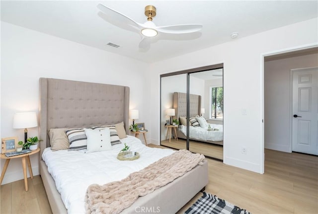 16066 Rancho Verde Cir, Riverside, CA 92506 - bedroom featuring light wood-style flooring, a closet, and ceiling fan