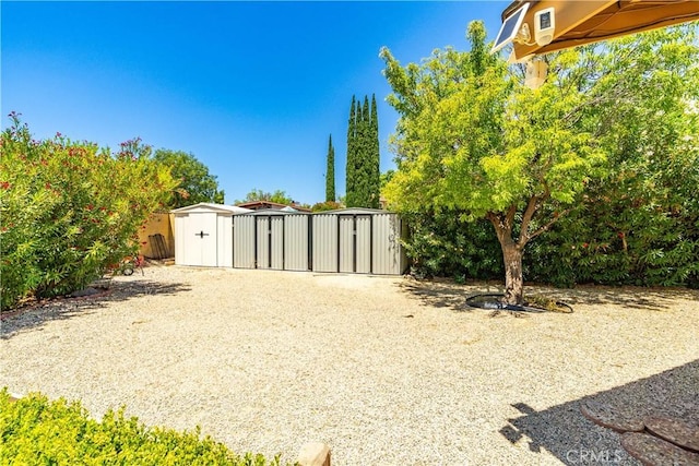 2608 Nice Ct, Lancaster, CA 93536 - view of yard featuring a storage shed