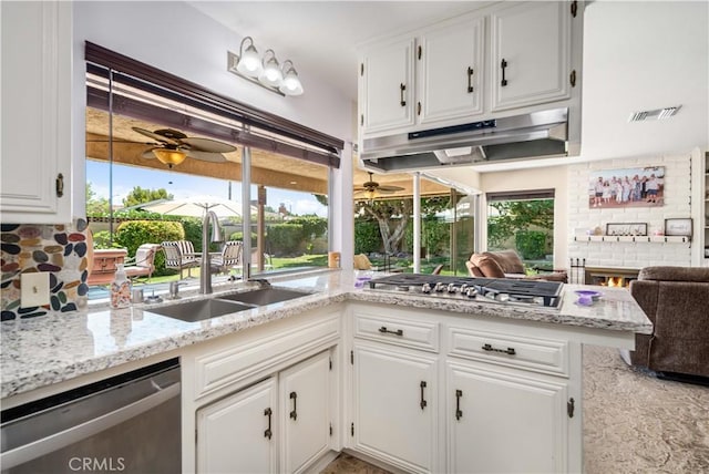 2608 Nice Ct, Lancaster, CA 93536 - kitchen featuring stainless steel appliances, under cabinet range hood, a ceiling fan, and white cabinetry