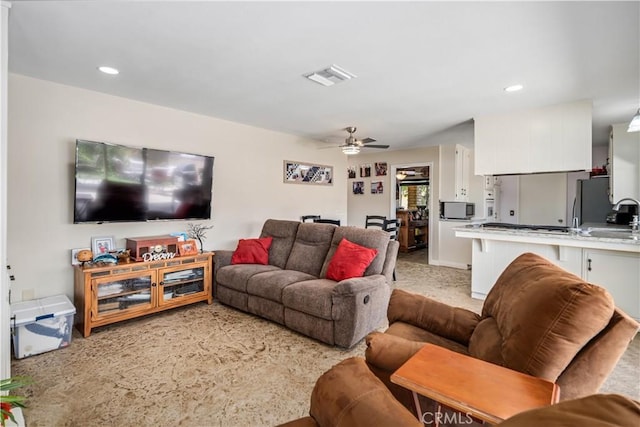 2608 Nice Ct, Lancaster, CA 93536 - living room featuring light colored carpet, a ceiling fan, and recessed lighting