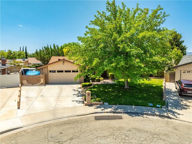 2608 Nice Ct, Lancaster, CA 93536 - view of property hidden behind natural elements featuring driveway and a gate