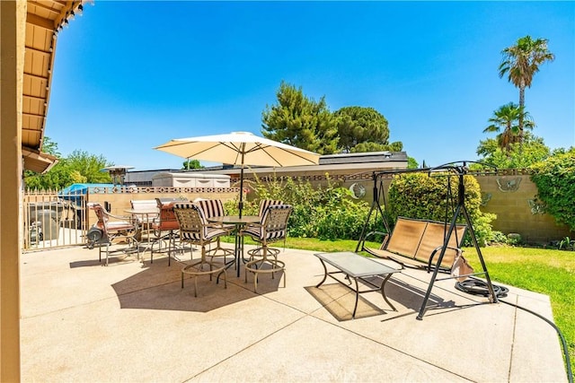 2608 Nice Ct, Lancaster, CA 93536 - fenced backyard featuring a patio and outdoor dining area