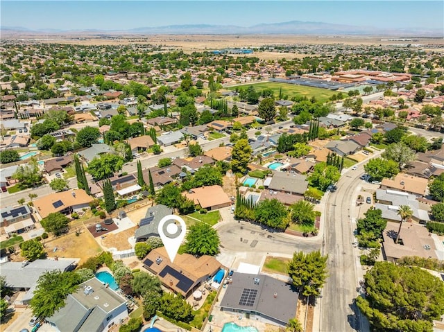 2608 Nice Ct, Lancaster, CA 93536 - aerial perspective of suburban area featuring a mountain backdrop and a pool area