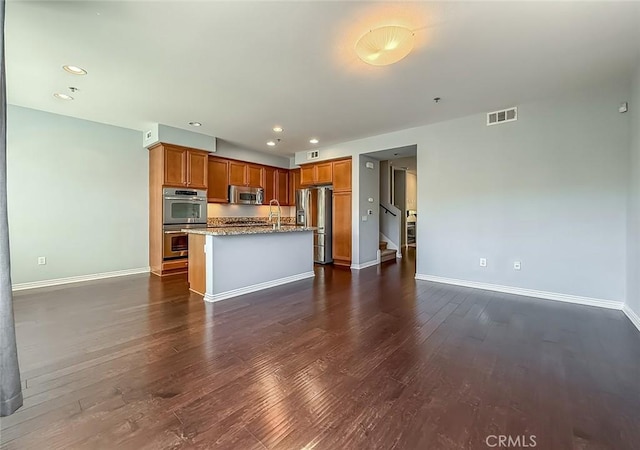 374 E Hilltop Way, Thousand Oaks, CA 91362 - kitchen featuring stainless steel appliances, dark wood-style flooring, brown cabinets, an island with sink, and recessed lighting