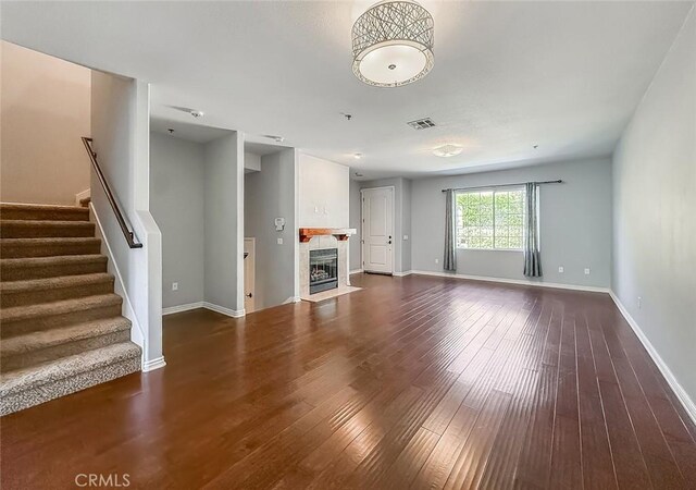 374 E Hilltop Way, Thousand Oaks, CA 91362 - unfurnished living room with stairs, dark wood-type flooring, and a fireplace