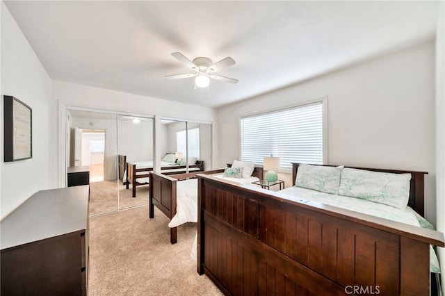 217 E Balboa Blvd, Newport Beach, CA 92661 - bedroom with light carpet, multiple windows, two closets, and a ceiling fan