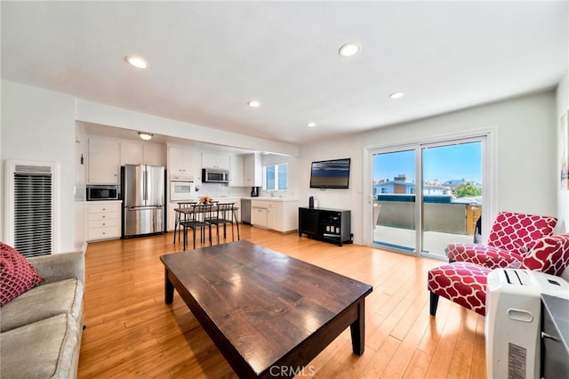 217 E Balboa Blvd, Newport Beach, CA 92661 - living area with a heating unit, light wood-style flooring, and recessed lighting