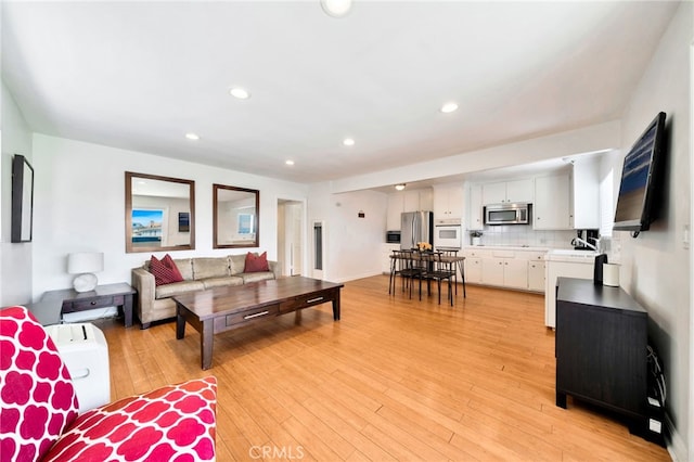 217 E Balboa Blvd, Newport Beach, CA 92661 - living room with light wood-style flooring and recessed lighting