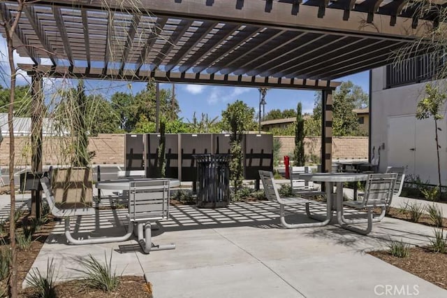12247 Elliott Ave Unit F, El Monte, CA 91732 - view of patio featuring a pergola and outdoor dining space