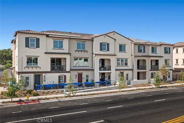 12247 Elliott Ave Unit F, El Monte, CA 91732 - townhome / multi-family property featuring a tiled roof and stucco siding