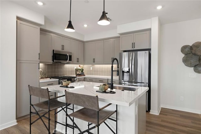 12247 Elliott Ave Unit F, El Monte, CA 91732 - kitchen with stainless steel appliances, gray cabinets, backsplash, dark wood finished floors, and recessed lighting