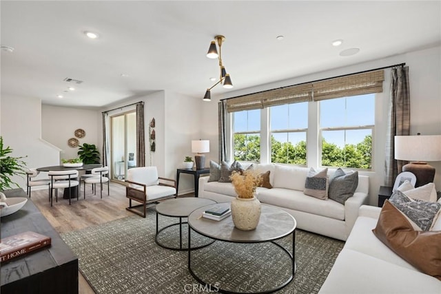 12247 Elliott Ave Unit F, El Monte, CA 91732 - living area with light wood-style floors and recessed lighting