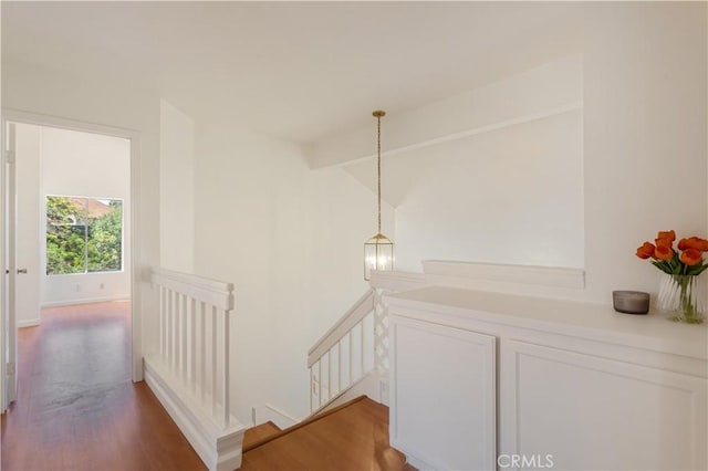24249 Saradella Ct, Murrieta, CA 92562 - corridor featuring an upstairs landing and wood finished floors