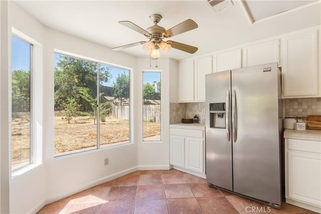 24249 Saradella Ct, Murrieta, CA 92562 - kitchen with stainless steel refrigerator with ice dispenser, tasteful backsplash, white cabinetry, light countertops, and ceiling fan