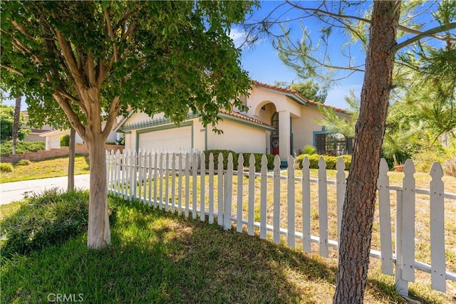 24249 Saradella Ct, Murrieta, CA 92562 - mediterranean / spanish-style house with a garage, driveway, stucco siding, and a tile roof