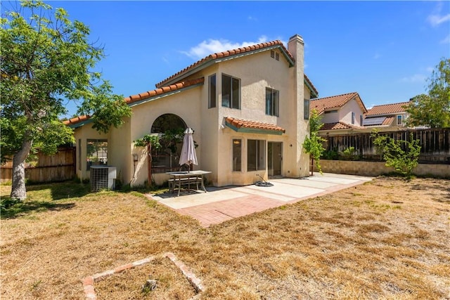 24249 Saradella Ct, Murrieta, CA 92562 - rear view of property featuring a tiled roof, stucco siding, and a fenced backyard
