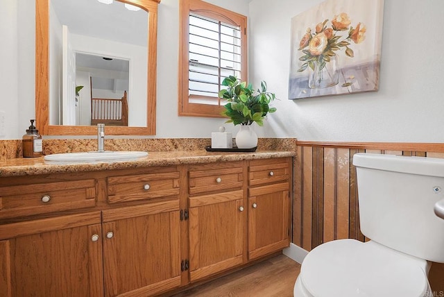 1930 Rosewood St, Vista, CA 92081 - bathroom featuring vanity, wood finished floors, and wainscoting