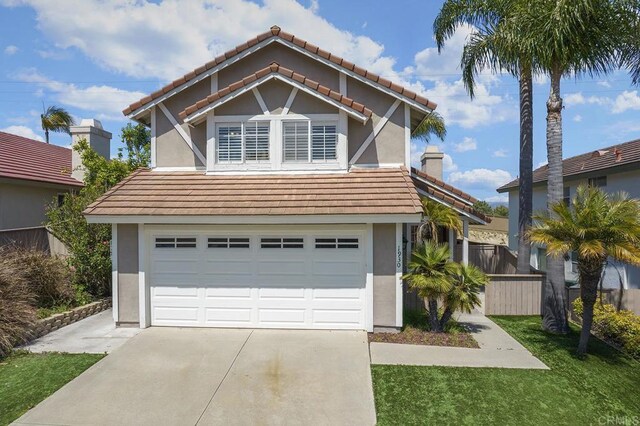 1930 Rosewood St, Vista, CA 92081 - view of front of property with stucco siding, a tiled roof, concrete driveway, and a garage