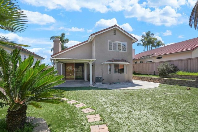 1930 Rosewood St, Vista, CA 92081 - back of property with stucco siding, a patio, and a chimney
