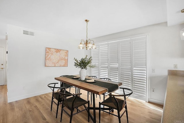 1930 Rosewood St, Vista, CA 92081 - dining space with a chandelier and light wood-type flooring