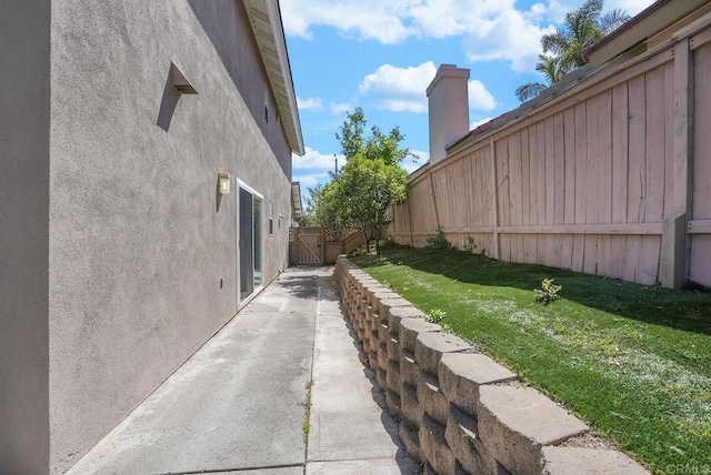 1930 Rosewood St, Vista, CA 92081 - view of home's exterior featuring stucco siding and a patio