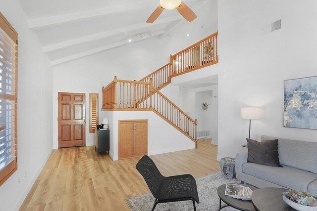 1930 Rosewood St, Vista, CA 92081 - living area featuring stairs, high vaulted ceiling, light wood finished floors, beam ceiling, and a ceiling fan