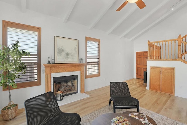 1930 Rosewood St, Vista, CA 92081 - living area featuring light wood-type flooring, a fireplace, a ceiling fan, and stairs