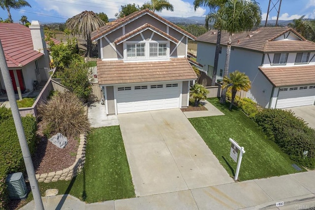 1930 Rosewood St, Vista, CA 92081 - view of front facade with stucco siding, driveway, and an attached garage