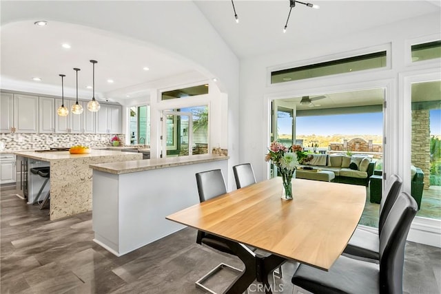 30282 Sonrisa, Laguna Niguel, CA 92677 - dining space featuring arched walkways, vaulted ceiling, and recessed lighting