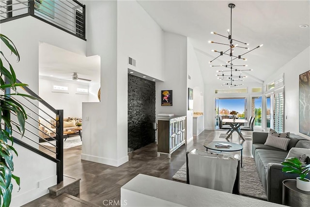 30282 Sonrisa, Laguna Niguel, CA 92677 - living room with high vaulted ceiling, a chandelier, stairway, and ceiling fan