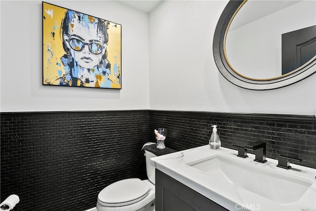 30282 Sonrisa, Laguna Niguel, CA 92677 - half bath featuring vanity, tile walls, and wainscoting