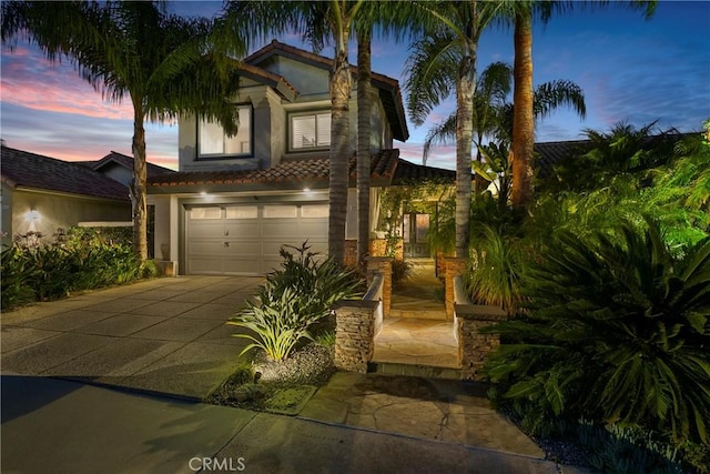30282 Sonrisa, Laguna Niguel, CA 92677 - mediterranean / spanish-style house featuring concrete driveway, an attached garage, stucco siding, and a tiled roof