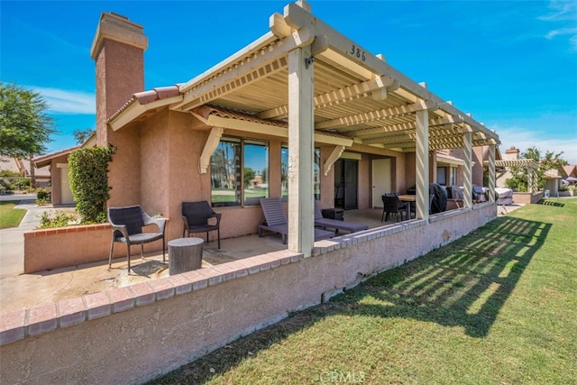 42386 Sultan Ave, Palm Desert, CA 92211 - back of property featuring a pergola, a chimney, a lawn, stucco siding, and a patio area
