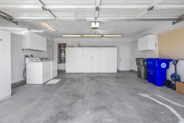 42386 Sultan Ave, Palm Desert, CA 92211 - garage with washing machine and dryer, a garage door opener, and strapped water heater
