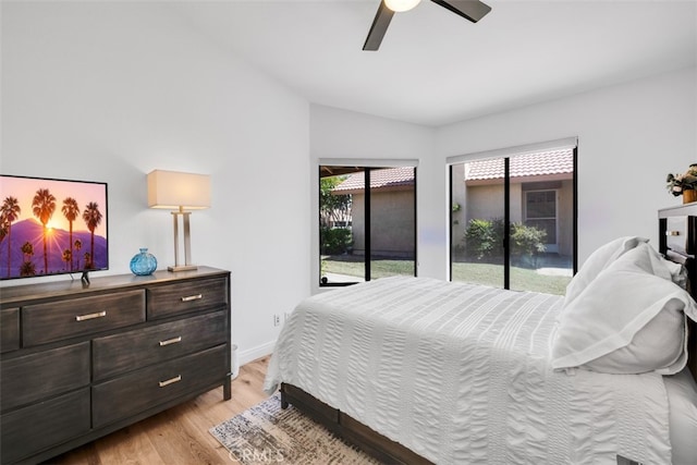 42386 Sultan Ave, Palm Desert, CA 92211 - bedroom with access to exterior, lofted ceiling, light wood-style flooring, and a ceiling fan