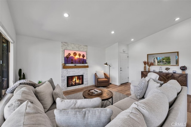 42386 Sultan Ave, Palm Desert, CA 92211 - living room featuring wood finished floors, lofted ceiling, a fireplace, and recessed lighting