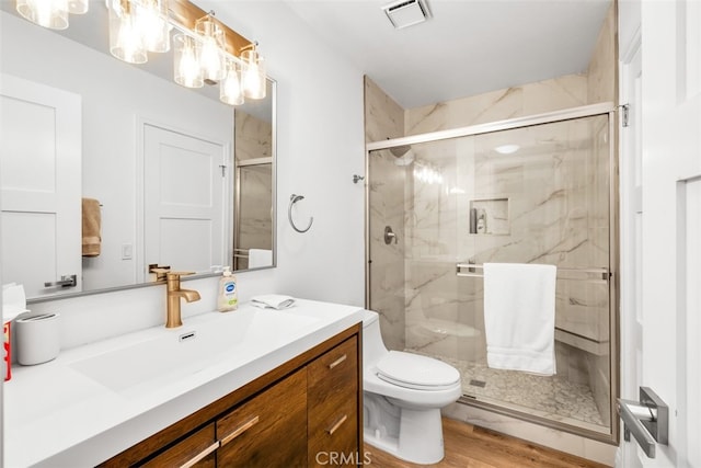 42386 Sultan Ave, Palm Desert, CA 92211 - bathroom featuring vanity, a marble finish shower, and wood finished floors
